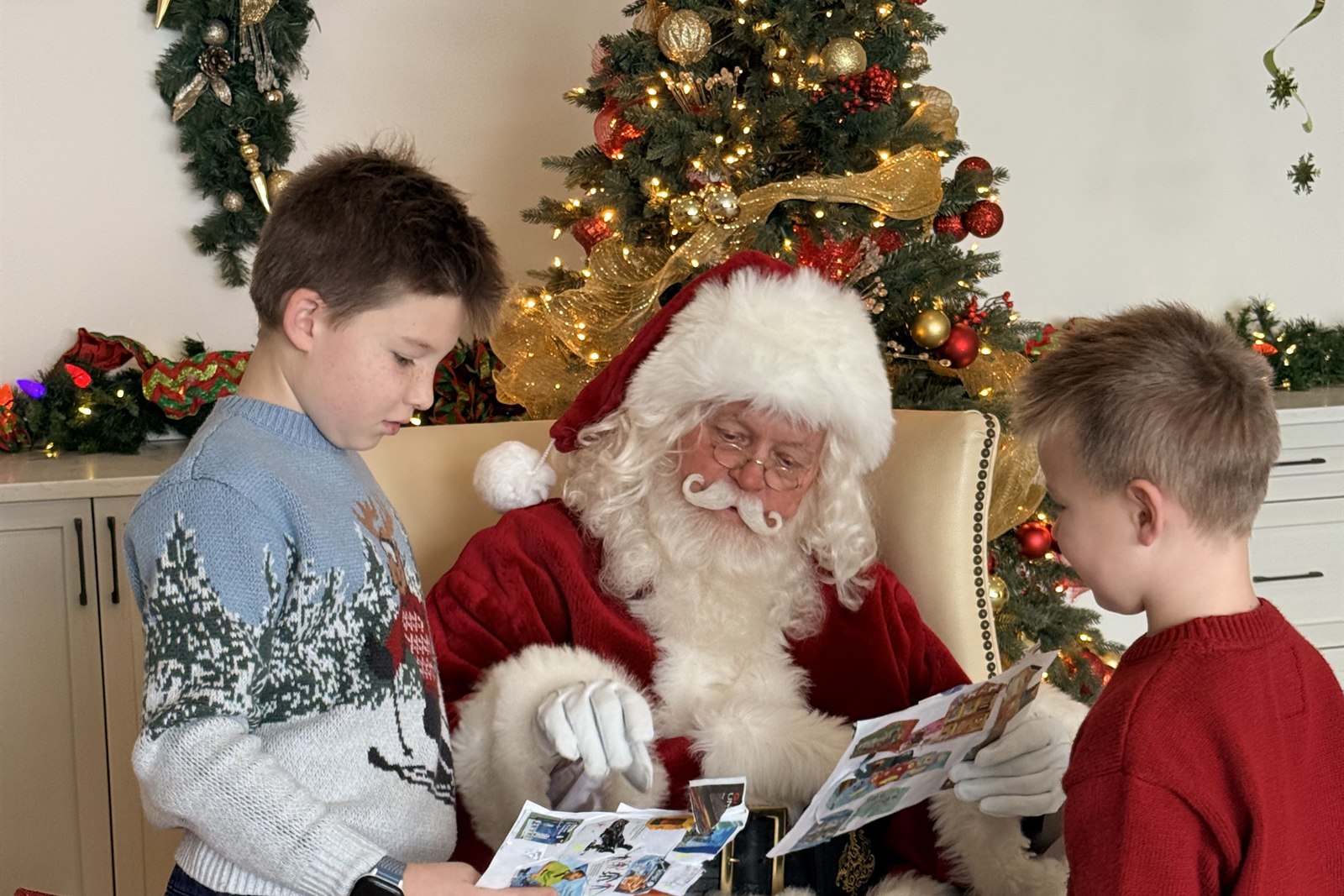 Santa reading wish lists at the club