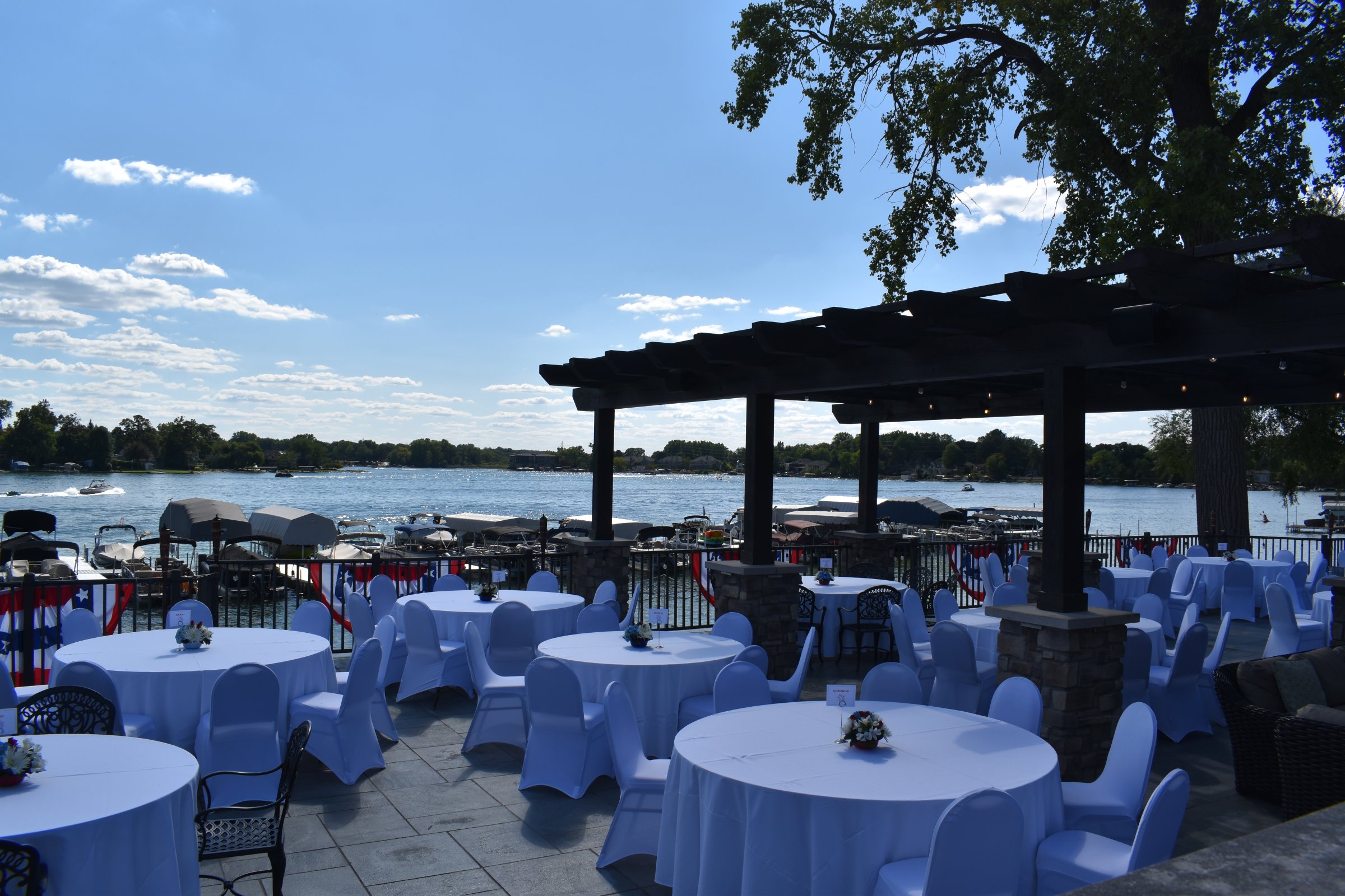 An event set for guests on the terrace above Pine Lake